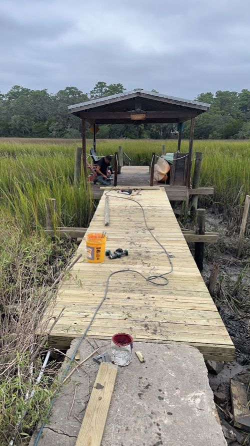  alt='These guys do a great job. We have used them for pinestraw, trimming palms, removing trees, rock and landscaping'